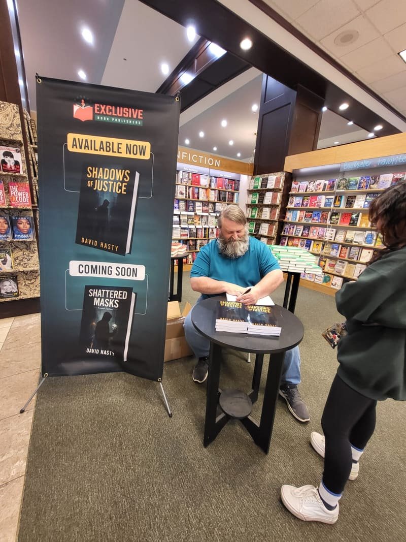Signing copies at a bookstore event